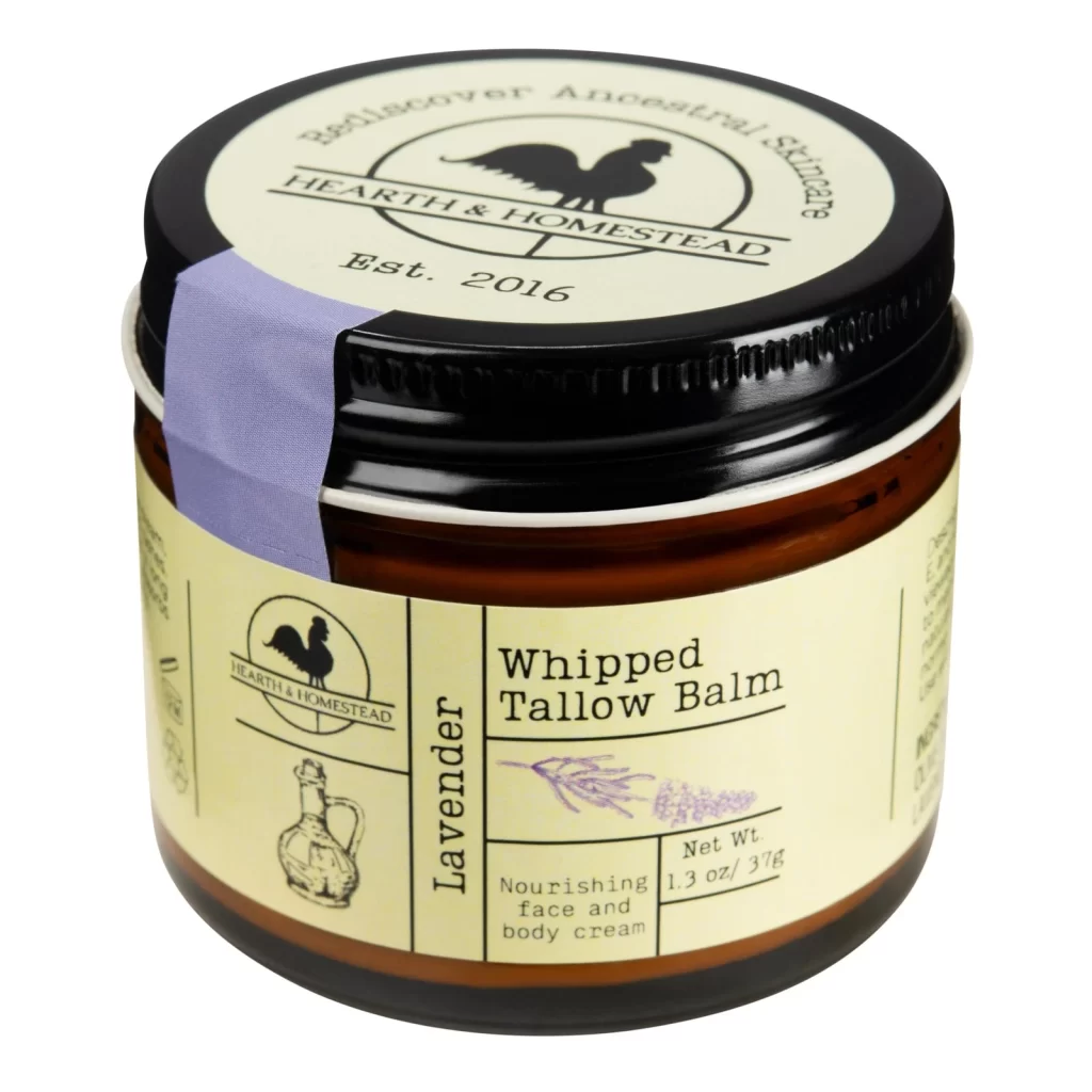 Glass jar of unscented whipped tallow balm with calendula petals, natural skincare for sensitive skin